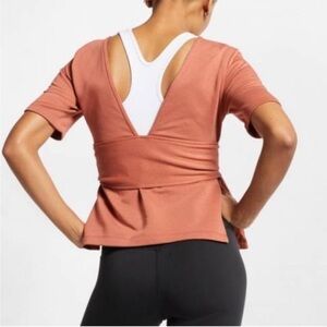 Nike Women's Dri-FIT Studio Short Sleeve Yoga Top, Dusty Peach Size XS, Wrap Tie